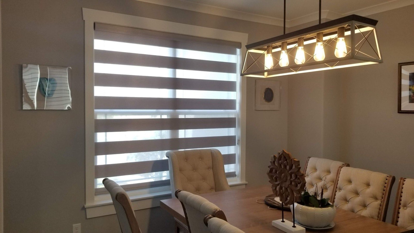 Banded shades above a dining table